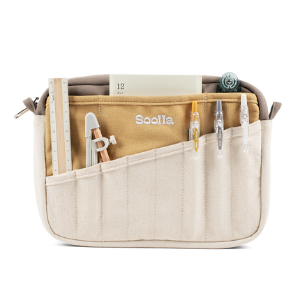 Studio supplies view of Soolla Studio Pouch in Driftwood, a pen pouch and soft pencil case for stationery and art supplies