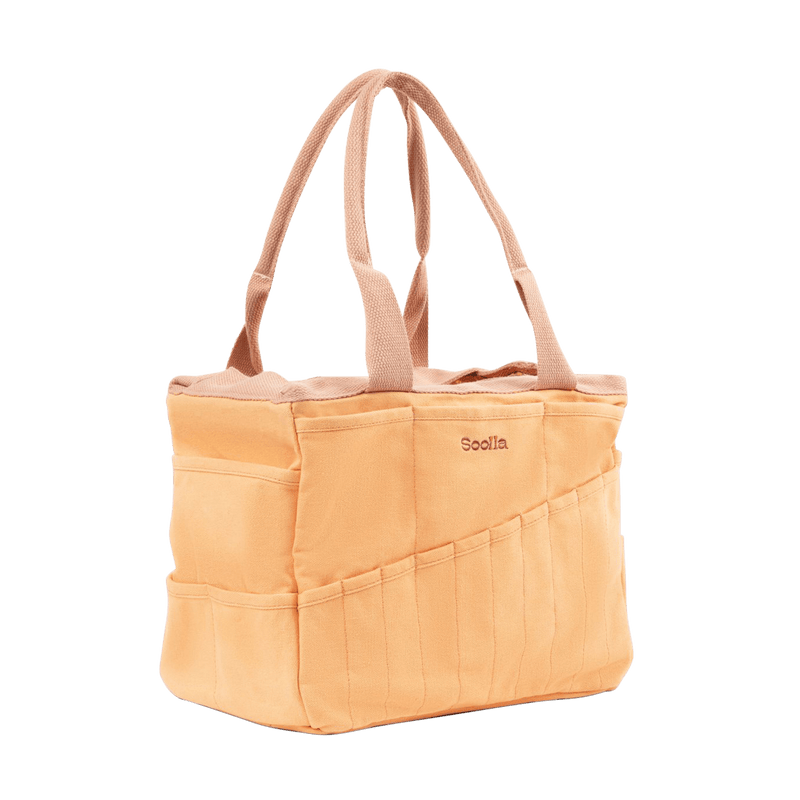 Left side view of Soolla Studio Bag in Creamsicle Crush, a pottery tool bag and artist bag