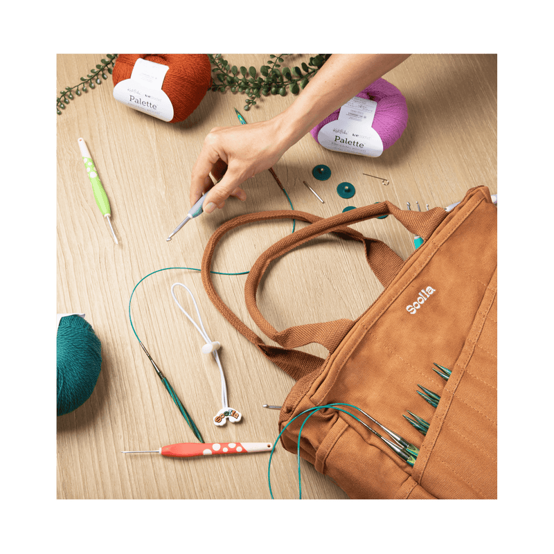 Flat lay of Soolla Studio Bag in Cinnamon Brown, an artist bag for pottery, knitting, and crochet supplies